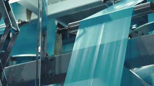 Industrial Machine Processing Blue Material in Factory