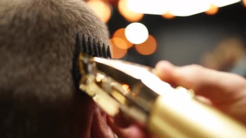 Barber Giving Man Haircut with Electric Razor