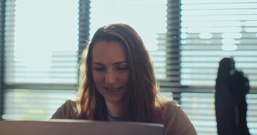 Female Browsing Internet Using Laptop Computer at Home Woman Remote Job From Home Office Typing