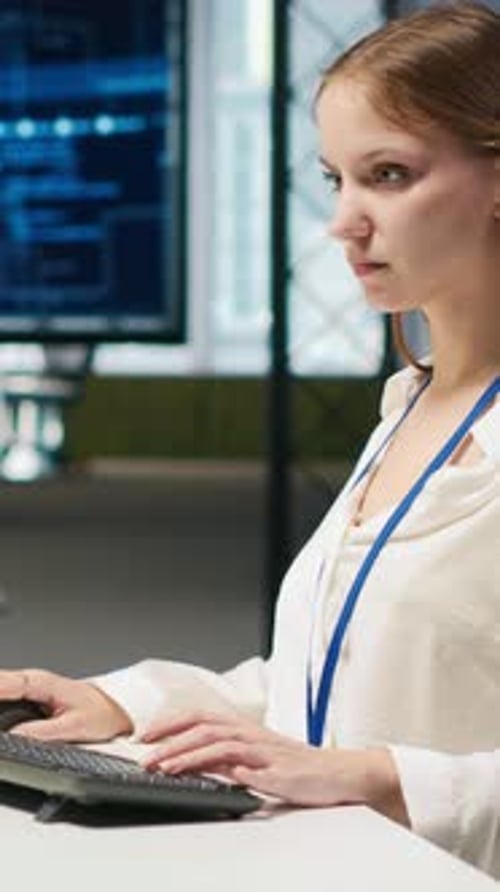 Woman Typing at Desk in Modern Office