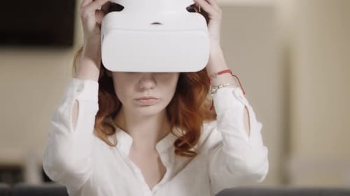Young Woman Using VR Headset at Home