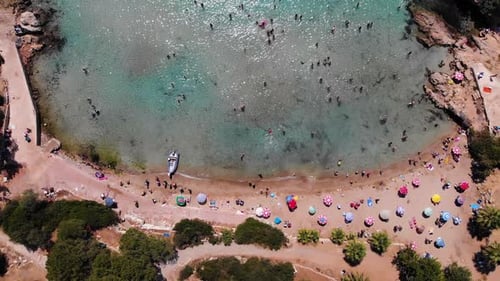 People swimming in the sea and sunbathing on the beach on the Turkish coast