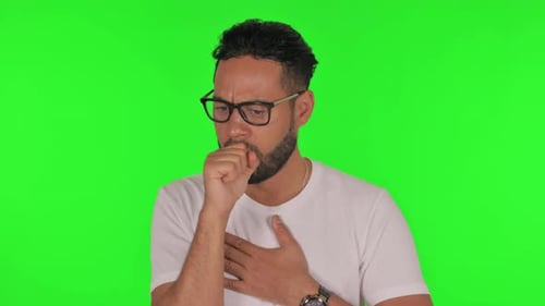 Sick Man Coughing on Green Background