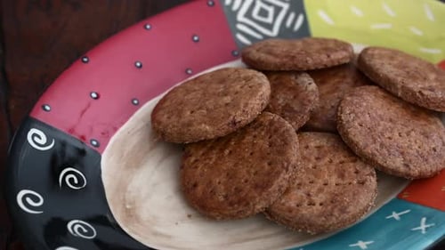 Brown Cookies Stacked on a Colorful Plate