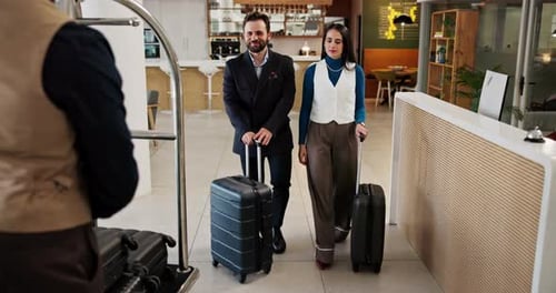 Hotel, luggage and people handshake with concierge for business travel, welcome and accommodation