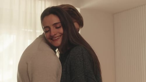 Couple Shares Intimate Moment in Bright Interior