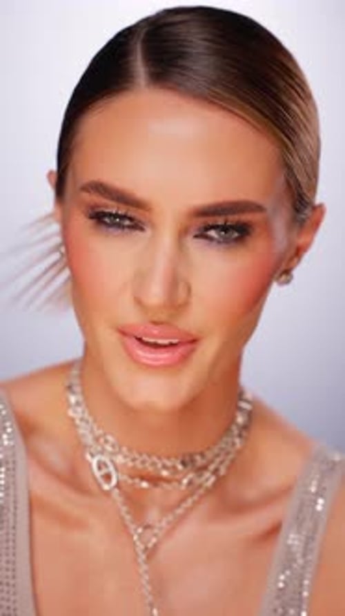 Woman Wearing Layered Silver Chain Necklaces