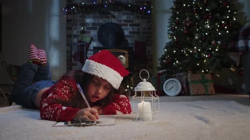 Girl writes letter to Santa on Christmas morning