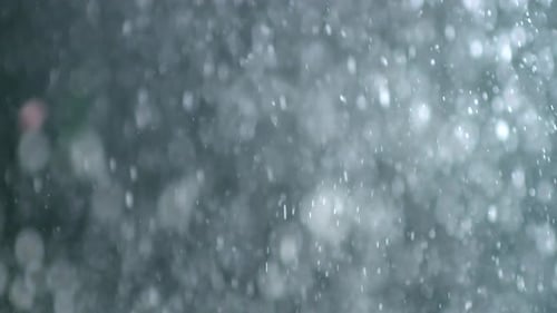 Collider Sammlung: Staubblasen mit Schneefalleffekt auf schwarzem Hintergrund