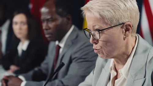 Caucasian Female Politician Delivering Angry Message at International Summit