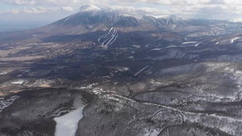 Aerial drone fly Mount Zaō Snow Covered Volcano Peaks landscape in Japan