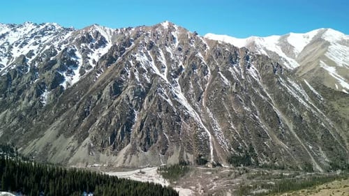 Large mountain at Ala-Archa Nature Park, drone circling shot