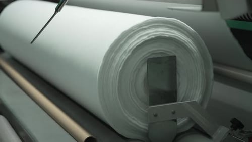 Roll of White Material on Production Machinery
