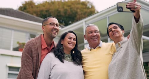 Four Happy Adults Posing Together for a Photo