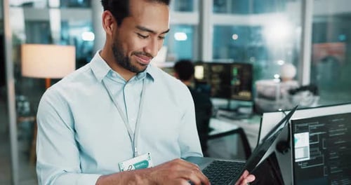Laptop, happy man and programmer typing in office for software development