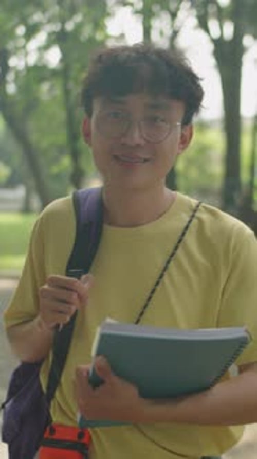Portrait of Young Asian Student in Park