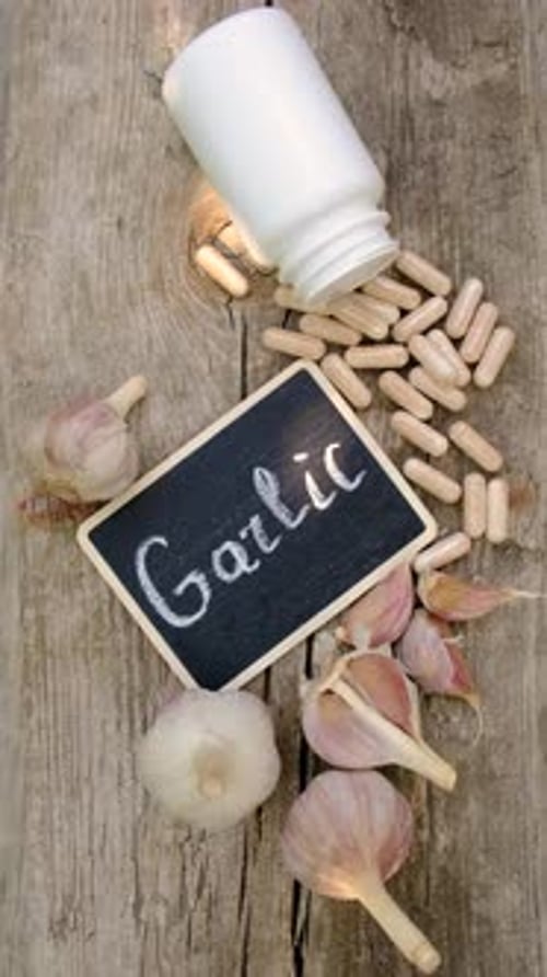 Garlic in Supplements on the Table Selective Focus