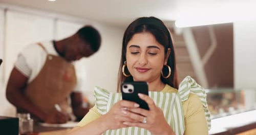 Internet, business and woman in cafe, cellphone and typing with social media, texting and email