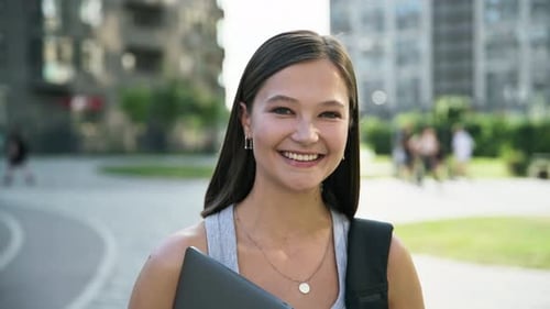 Young Beautiful Woman Student Posing with Laptop Backpack Outdoor City Background