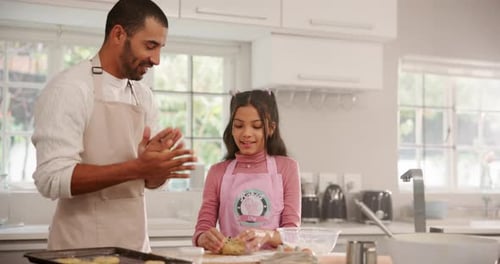 Father and Daughter Baking Together in Bright Kitchen