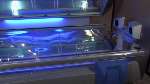 Tanning Bed with Blue Lights Inside