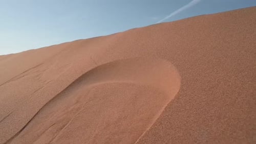 Desert. Sand blows from the dunes. Sahara desert