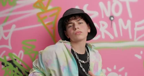 Cool Teen Dancing in Front of Graffiti Wall