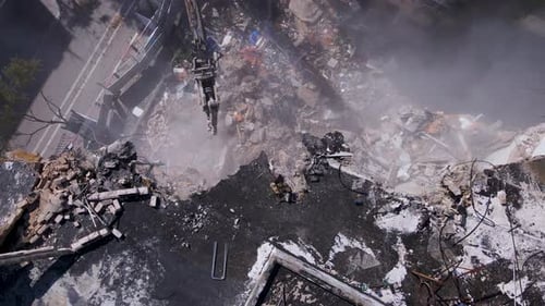 Powerful Heavy Equipment Working On Building Demolition. Aerial Topdown Shot