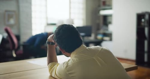 Employees Getting Tired And Falling Asleep At Their Desks In Modern Well Lit Office During The Da...