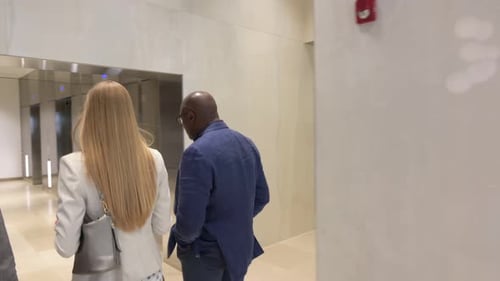 Business People Walking Toward Elevators in Office 2024 Years