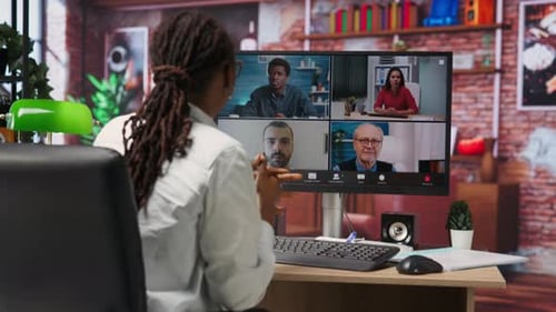 Remote Worker in Home Office Saluting Coworkers During Internet Videocall