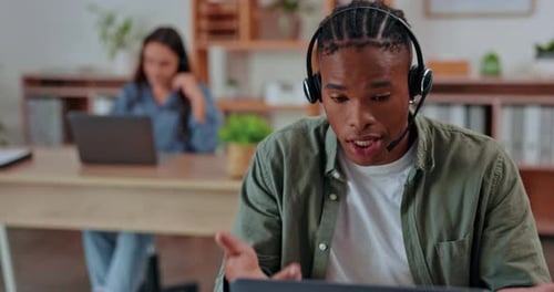 Black man, call center and laptop with headset consulting in telemarketing