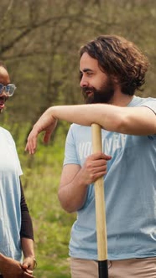 Volunteers smiling in a nature setting