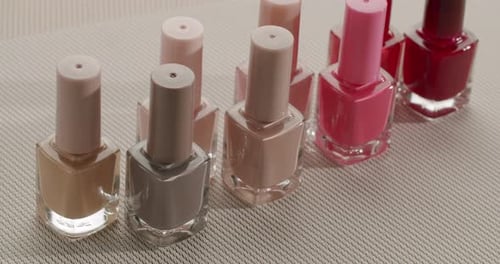 Bottles of Nail Polish Panning Across the Table
