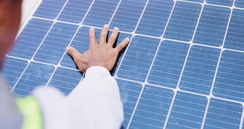 Touching a Blue Solar Panel Surface