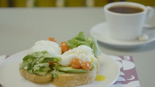 Toast with Poached Eggs, Avocado, and Fresh Coffee