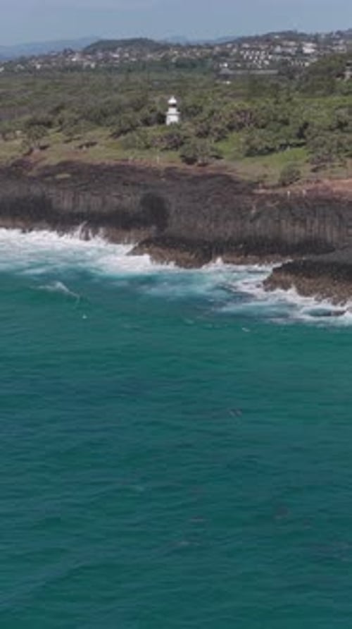Dolphins In Blue Ocean, Fingal Headland In NSW, Australia - Drone, Vertical Shot