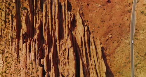 Road going parallel to the beautiful rocks in Arches National Park.