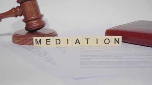 Close Up of Gavel, Documents, and Mediation Blocks