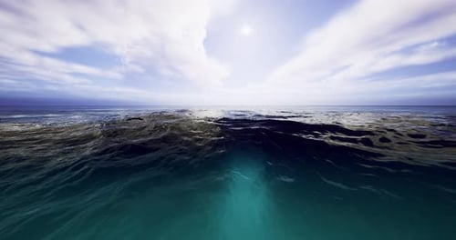 Expansive Ocean View with Dramatic Clouds and Bright Sunlight on Horizon