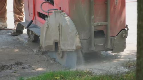 Close Up Shot of Cutting Saw on Tarmac to Cut a Road Surface for Repair Slow Motion
