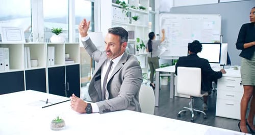 Businessman Celebrating with Paper Throw in Modern Office