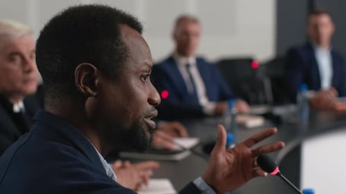 Speech of Political Speaker at Meeting Room of Modern Business Center. Adult