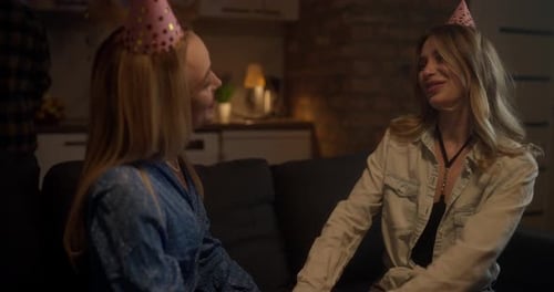Two Young Women Celebrating Birthday on Couch