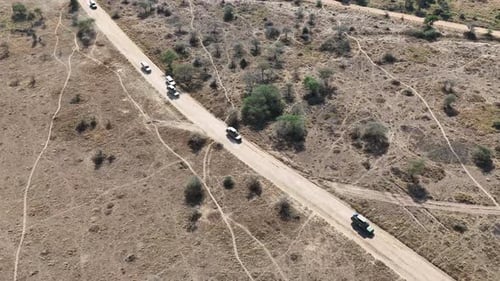 Aerial footage of safari 4x4 cars in Serengeti National Park, Tanzania