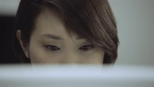 Woman working on computer in office