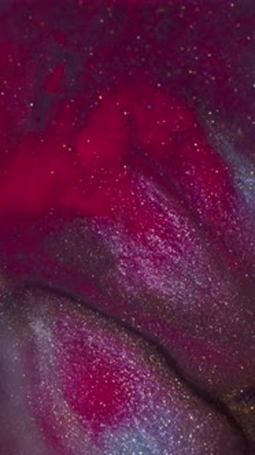 Sparkling Multicolored Liquid Mixing in Swirling Abstract Patterns