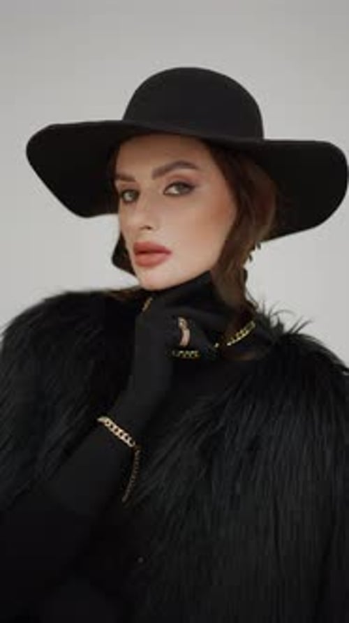 Shooting of Photographer and Model of Fashionable Beautiful Sexy Woman in Black Clothes in Studio on