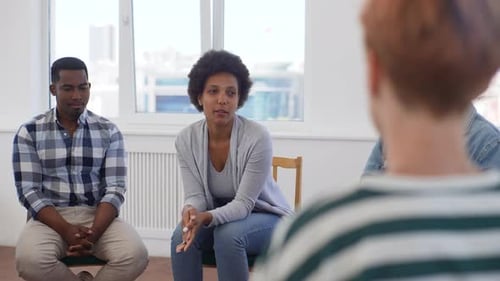 Adults Sitting in Group Therapy Circle