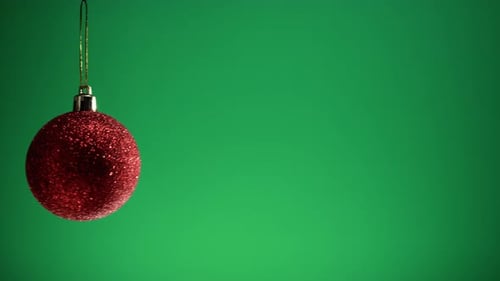 Red Christmas Ball with Green Background